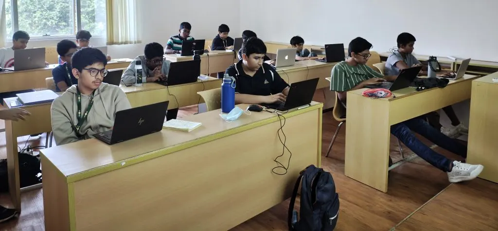 A GenWise classroom full of students working on laptops